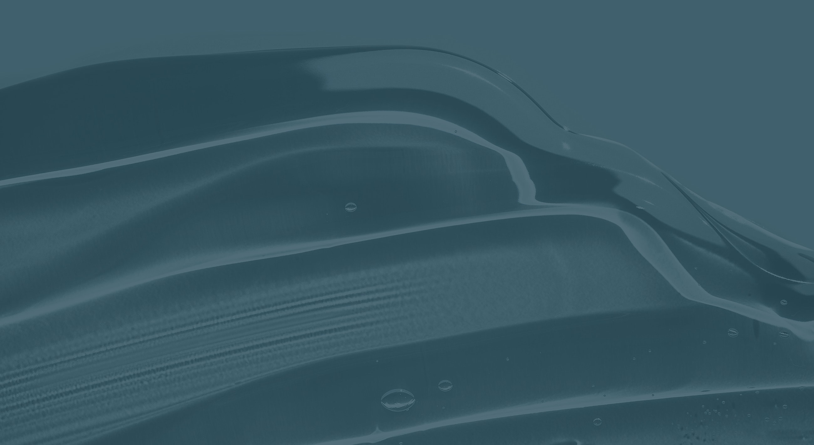 Abstract blue waves with subtle reflections and bubbles.