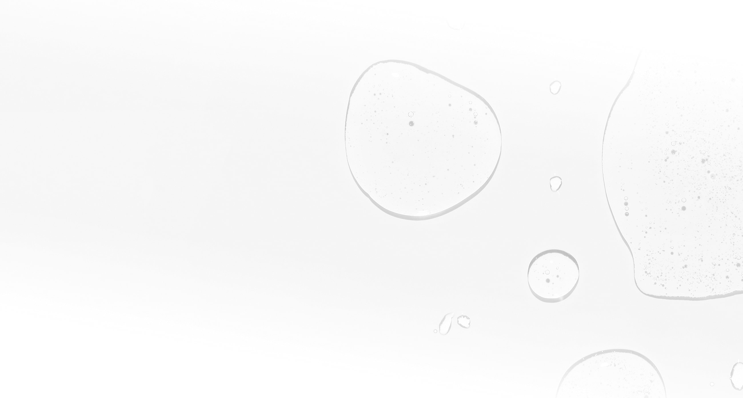 Blobs of liquid on a white background.