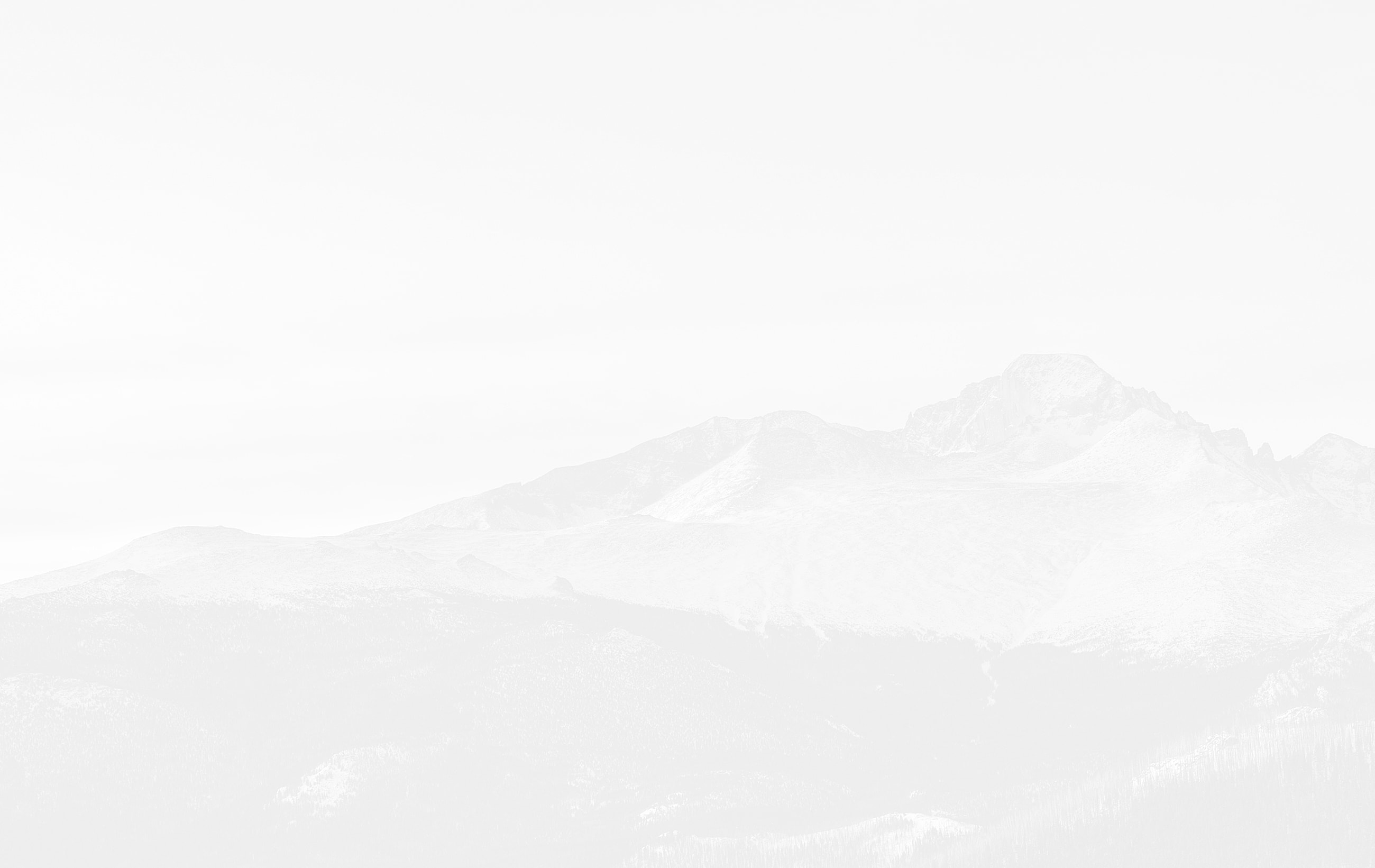 Foggy mountain landscape in monochrome tones.