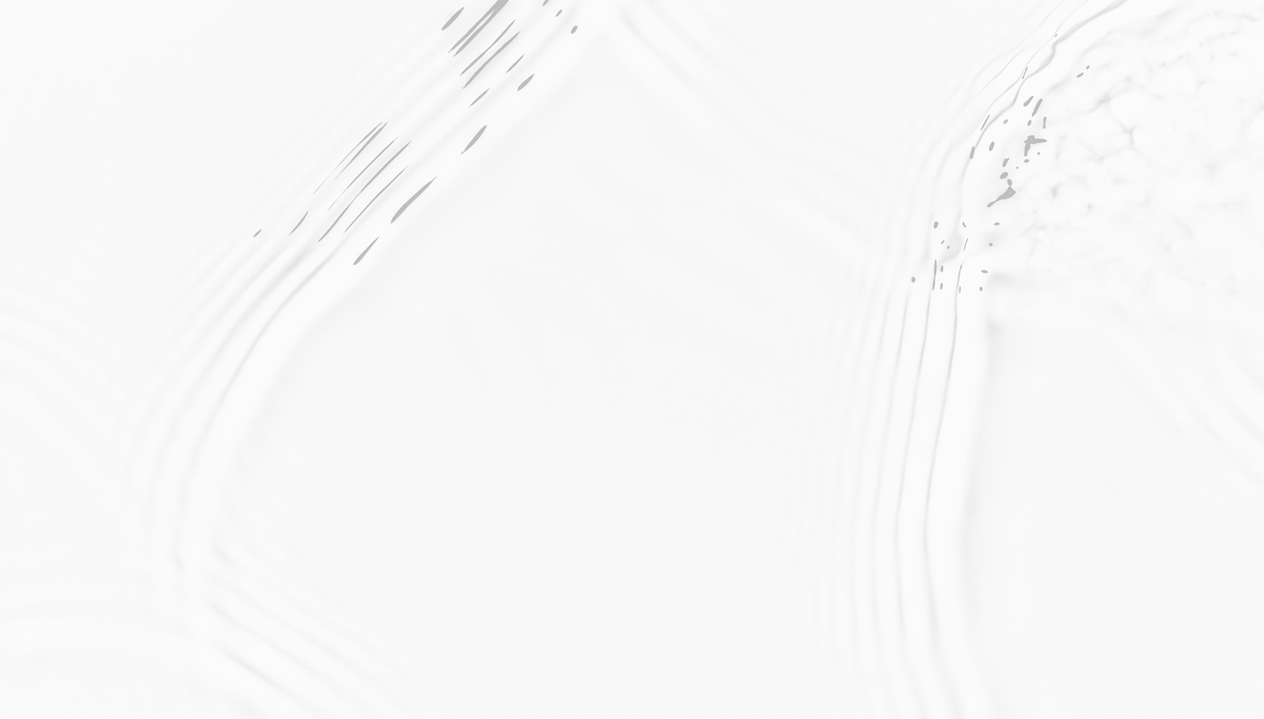 Smiling woman applying skincare on her face.