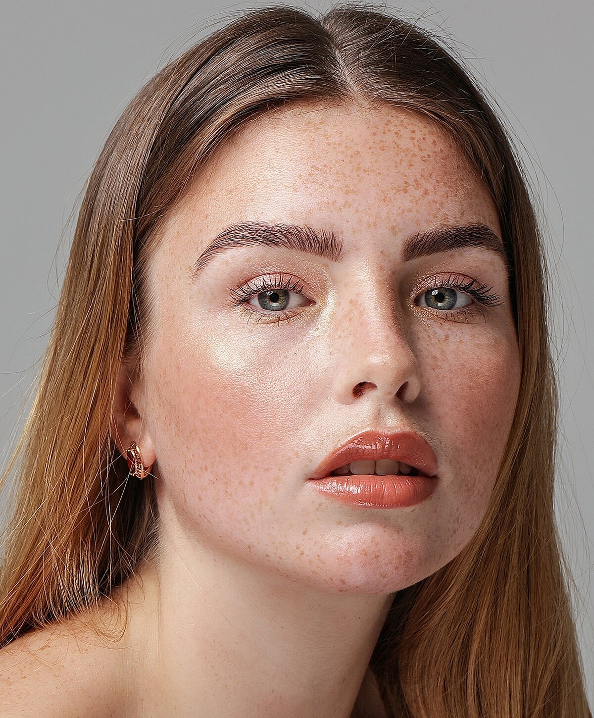 Close-up of woman in stylish black blouse.