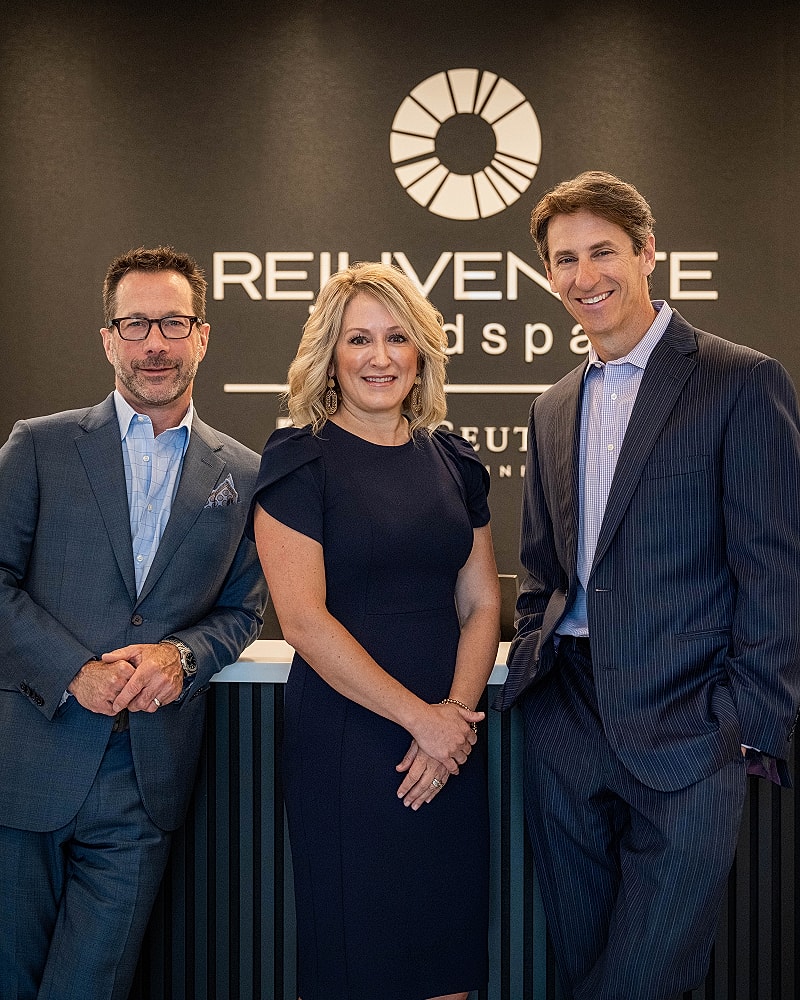 Three professionals in a wellness business setting.