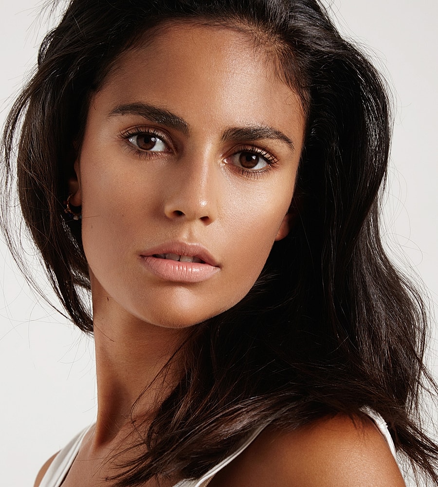 Close-up of a woman's face with long hair.