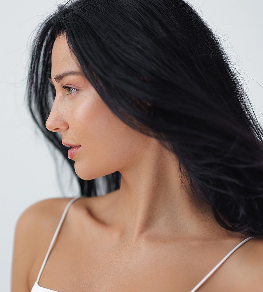 Profile of a woman with flowing dark hair