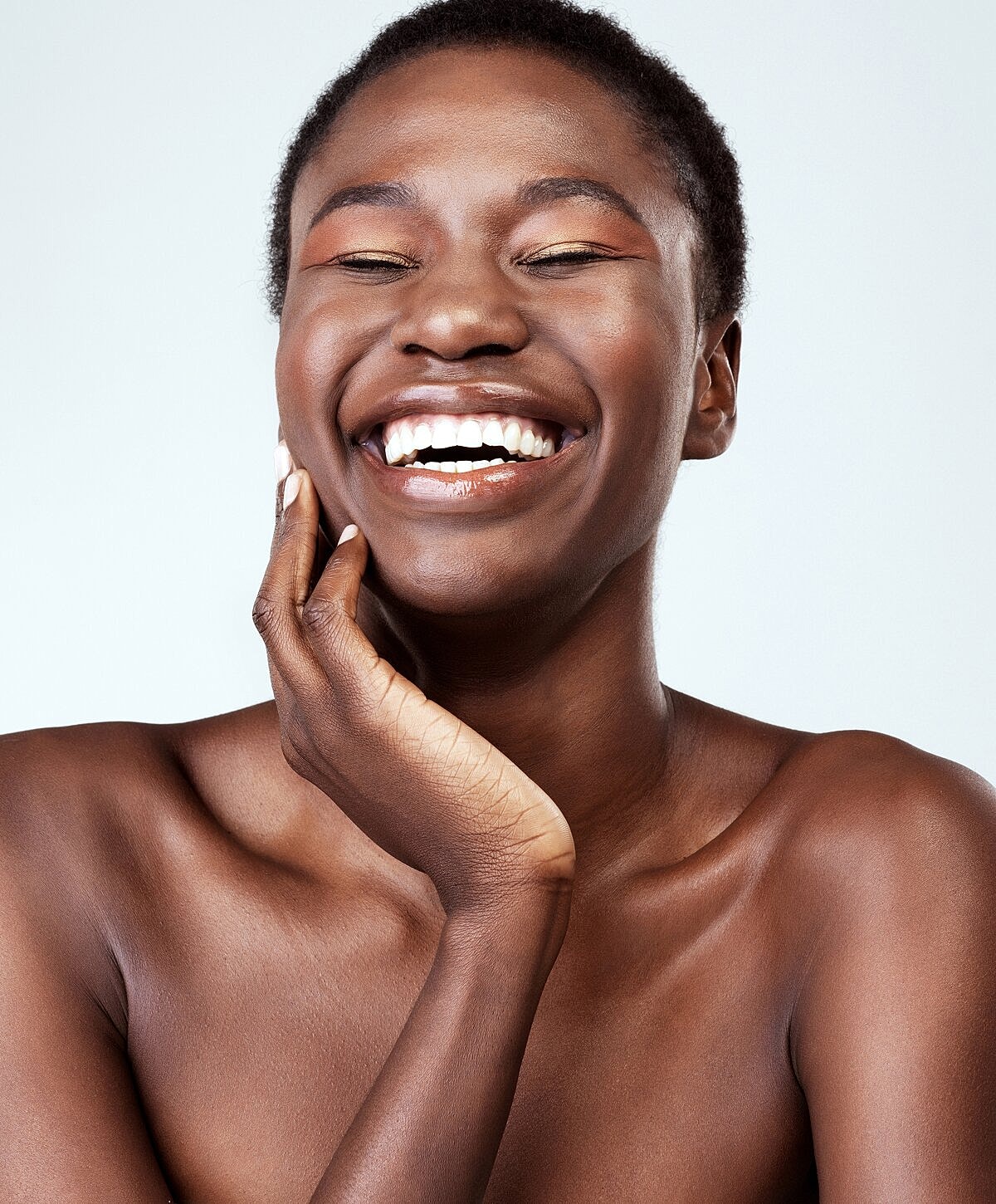 Smiling woman with short hair, natural beauty.