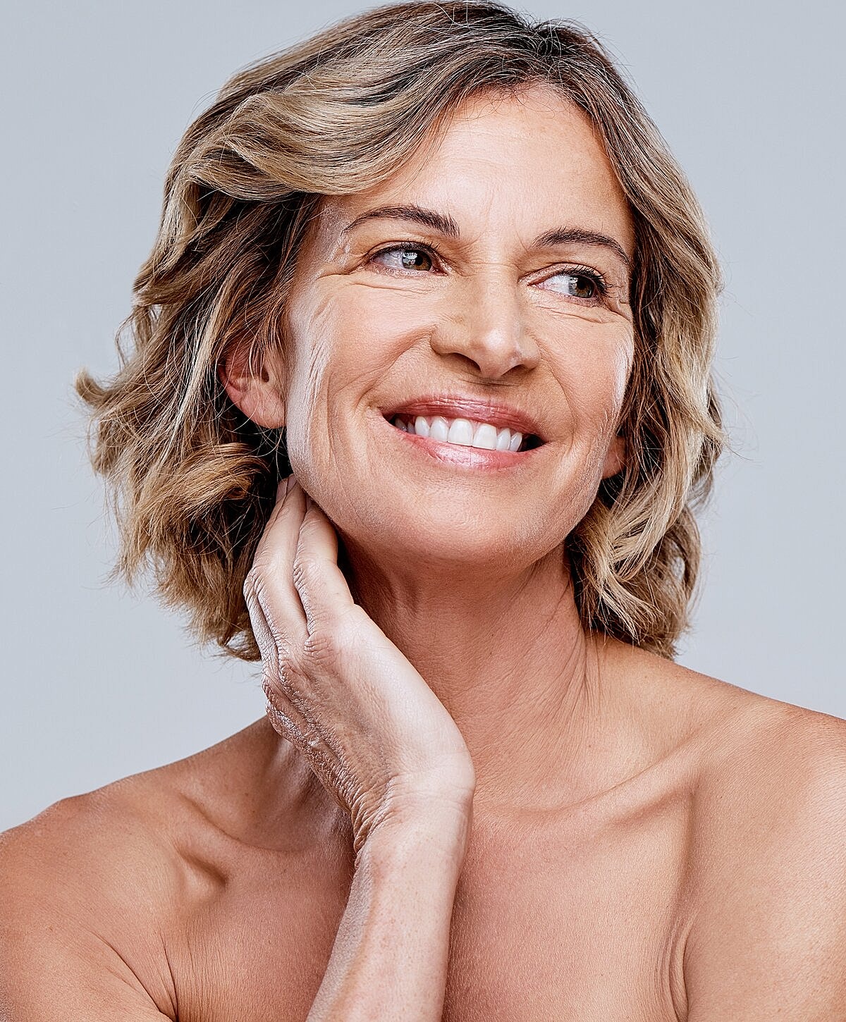 Smiling middle-aged woman with medium-length hair.