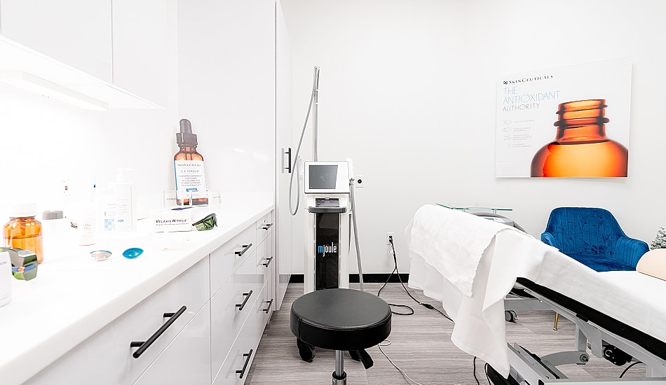 Skincare treatment room with equipment and products.