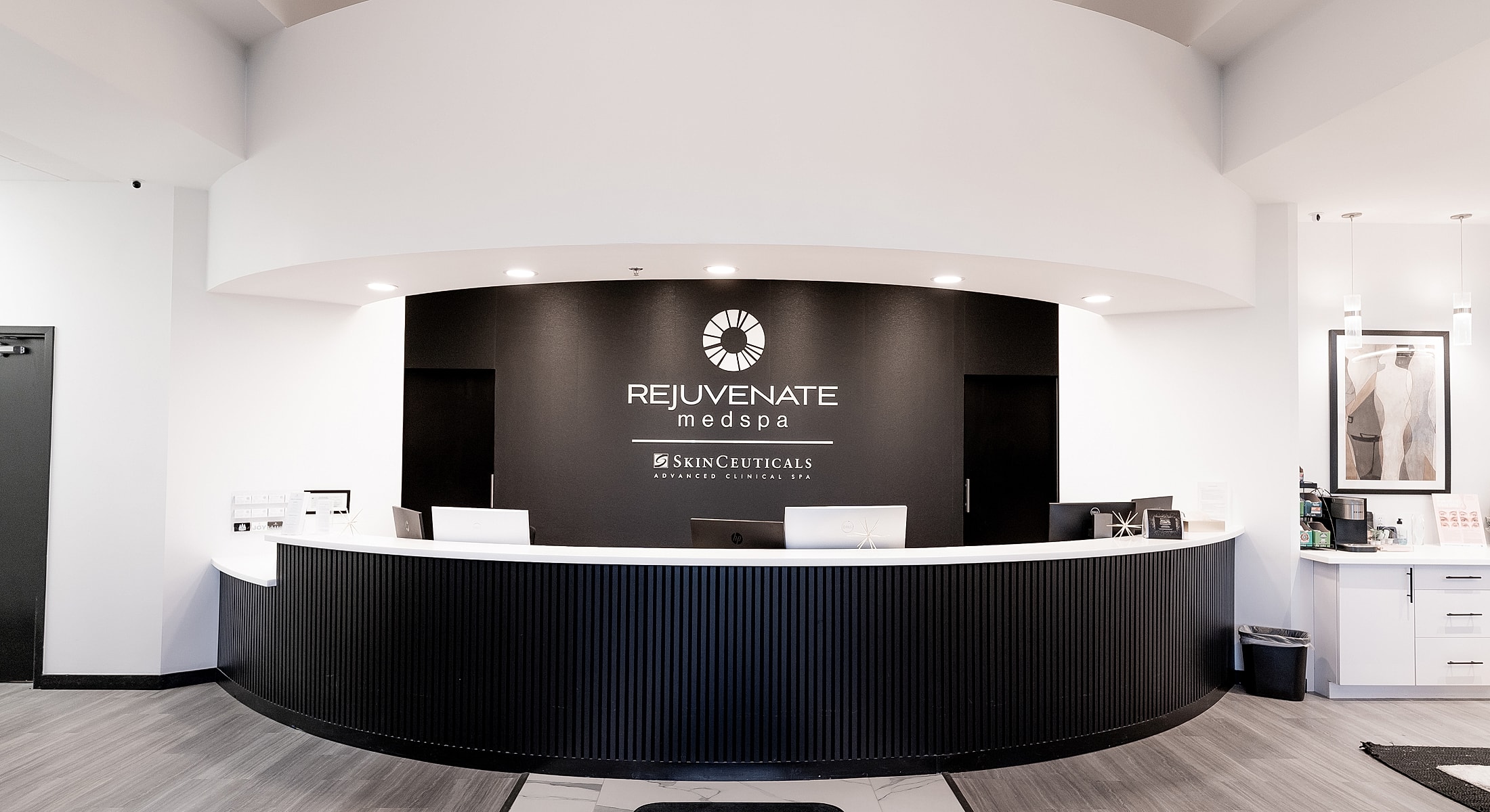 Modern medspa reception area with branding.