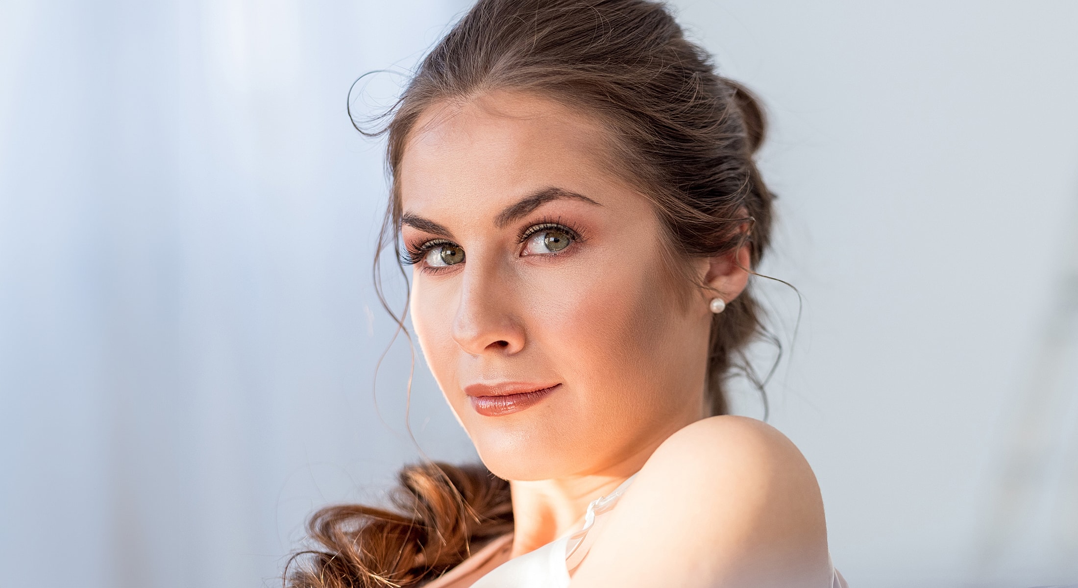 Portrait of a woman with dark eyelashes.